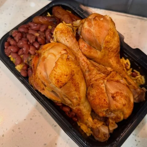 Roasted chicken lunch special with red beans, yellow rice and sweet plantains